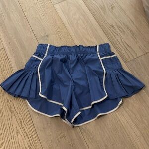 Blue free people athletic shorts with white lines